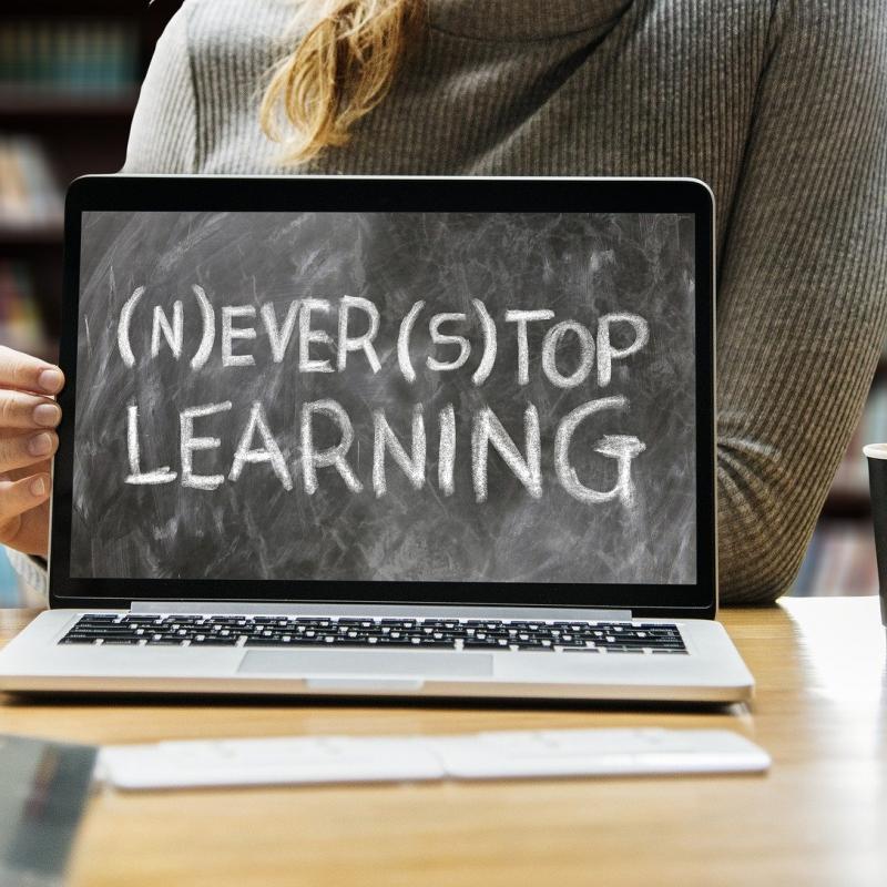 laptop with message never stop learning